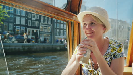 woman on canal cruise in amsterdam