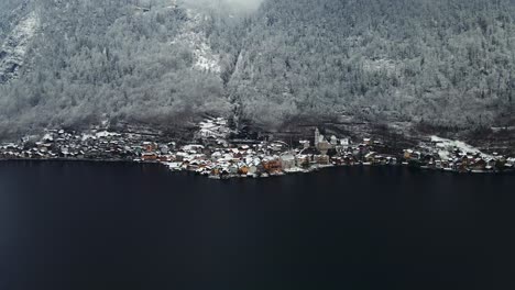 Footage-filmed-with-a-drone-over-a-lake-by-a-town-called-Hallstatt-in-Austria-in-Europe