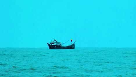 blue hour background as fishing trawler working in the indian ocean