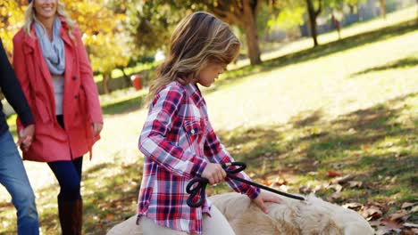 family walking with dog outdoors