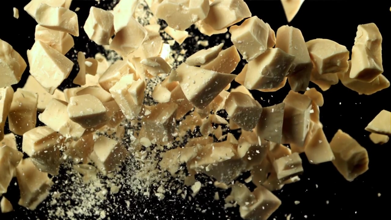 White Chocolate Chunks Exploding and Scattering in Slow Motion