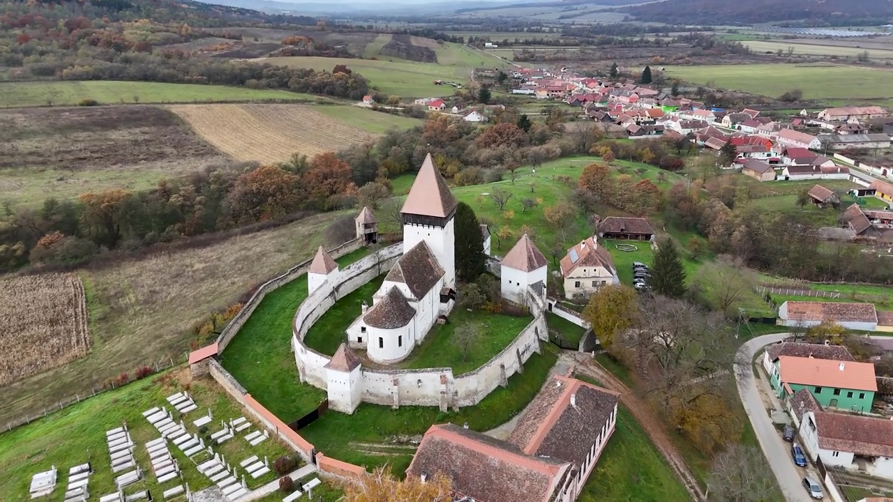 Experience the grandeur of Hosman Fortified Church in Transylvania, Romania, with this stunning drone footage.