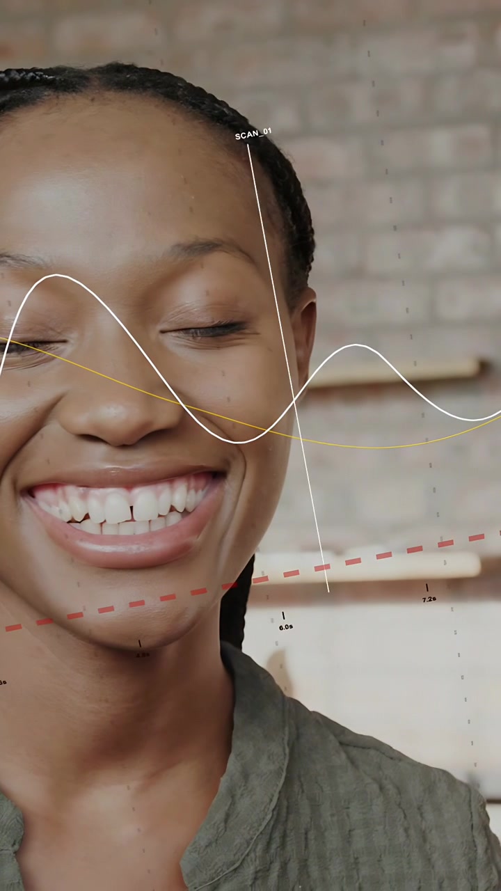 Vertical video: Woman sitting loft overlays moving causing turning smiling wave scanning face tech