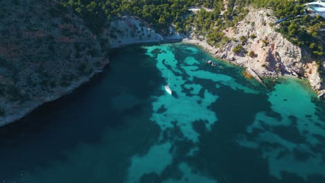 Pristine-clear-turquoise-water-beach-bay-with-yacht-ship-sailing-boat-at-on-Palma-de-Mallorca-Island