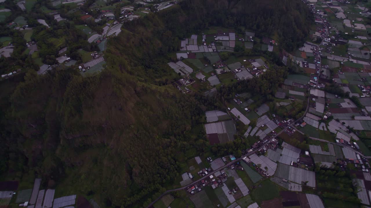 Morning light on Batur volcano with lake and village in Bali