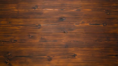 los regalos de navidad aparecen en manos femeninas en un fondo de madera oscura, detenga la movimiento