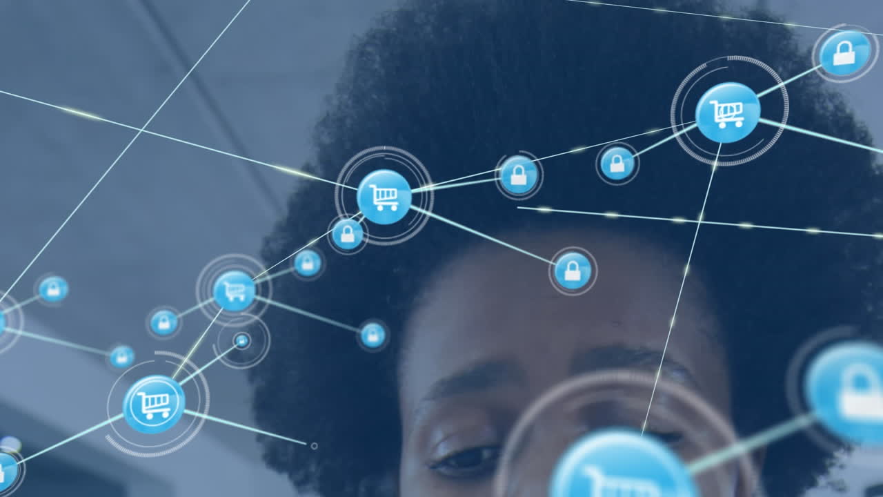 Animation of network of digital icons against close up of african american woman at office