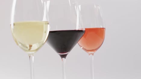Diverse-types-of-wines-in-glasses-on-white-surface-with-copy-space