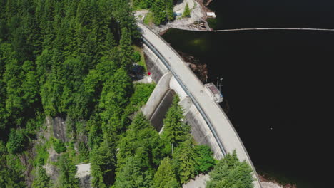 Aerial-view-over-the-Cleveland-Dam-at-Capilano-River-Regional-Park,-North-Vancouver