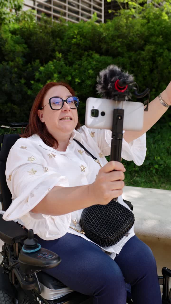 Woman in Wheelchair Vlogging Outdoors