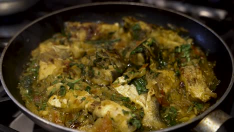 view of fish curry being fried in saucepan