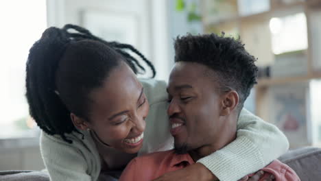 Tablet,-hug-and-happy-black-couple-on-sofa-in-home