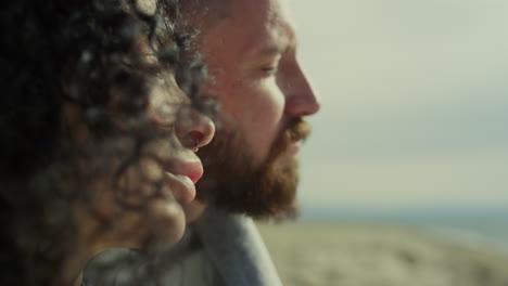 couple face looking calm on relax sea beach. people enjoy close eyes on nature.