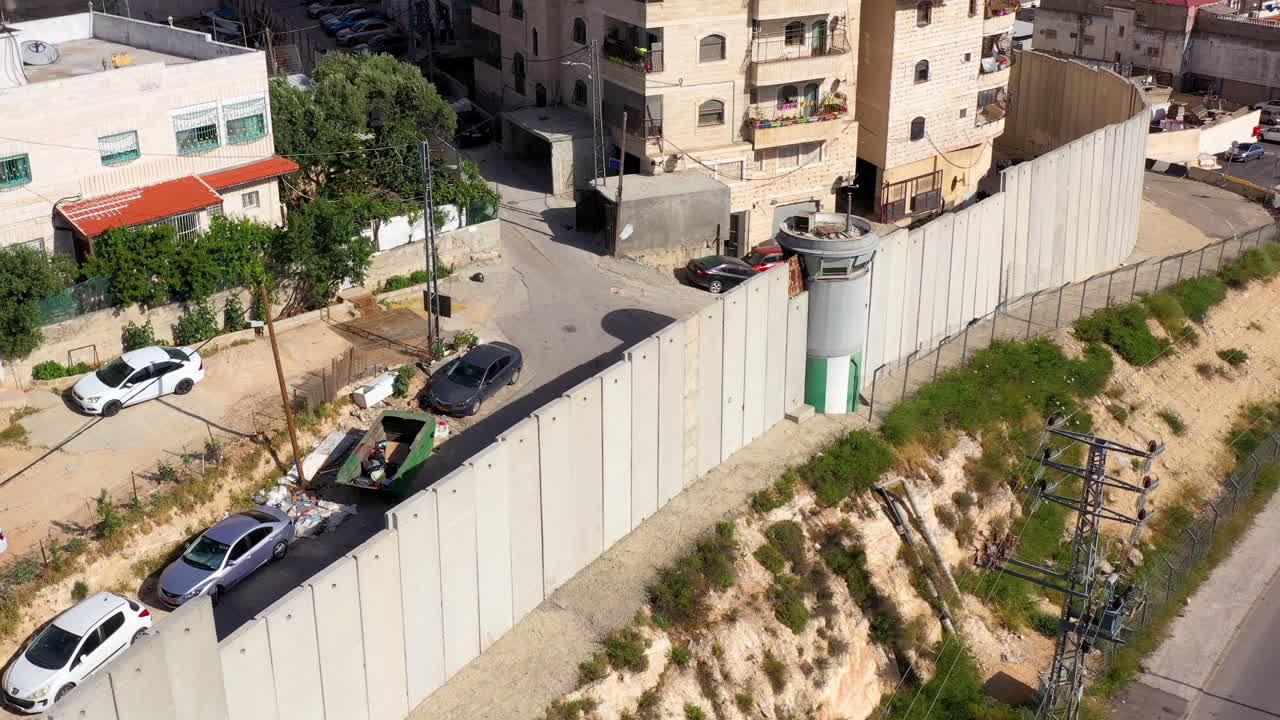 View of Separation Barrier with Buildings and Cars