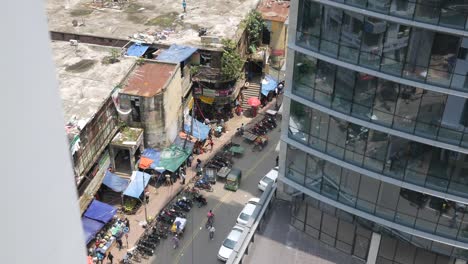 contrast of urban development and street market