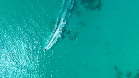 drone aerial landscape of jet ski watercraft cruising through shallow sandbar reef cancun mexico central america holidays travel tourism activities sports outdoors