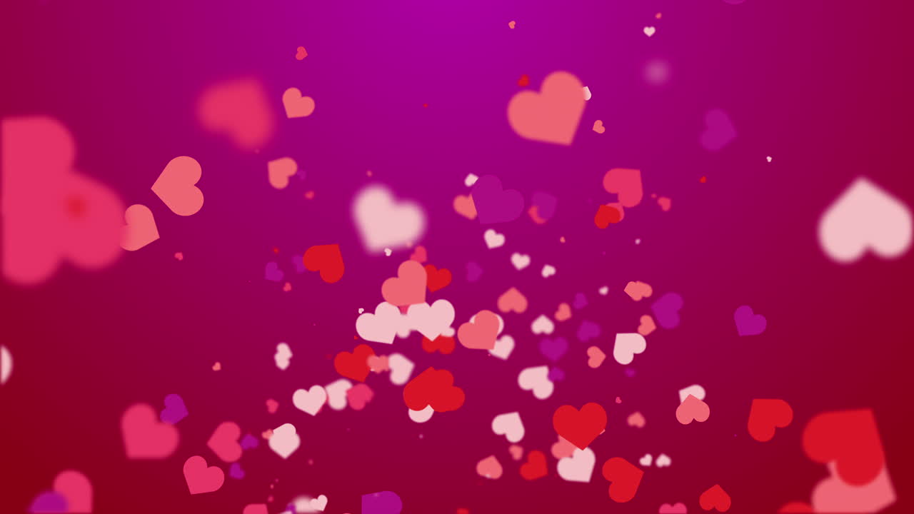 Freely falling down colored figures of hearts. Animated abstract red background. Looped video. Concept for valentine's day, wedding.