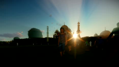 taj mahal with tourists walking against beautiful sunset, 4k