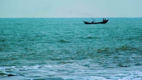 fishermen is wooden trawler boat sail along coast in indian ocean
