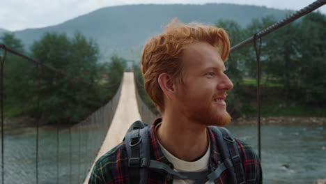 Closeup-happy-hipster-trekking-mountains-at-summer.-Backpacker-explore-nature.