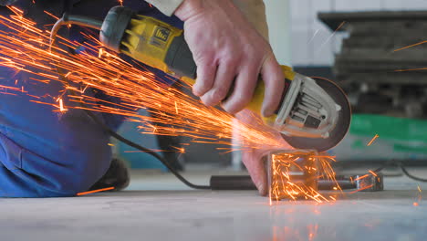 man cutting metal with circular saw