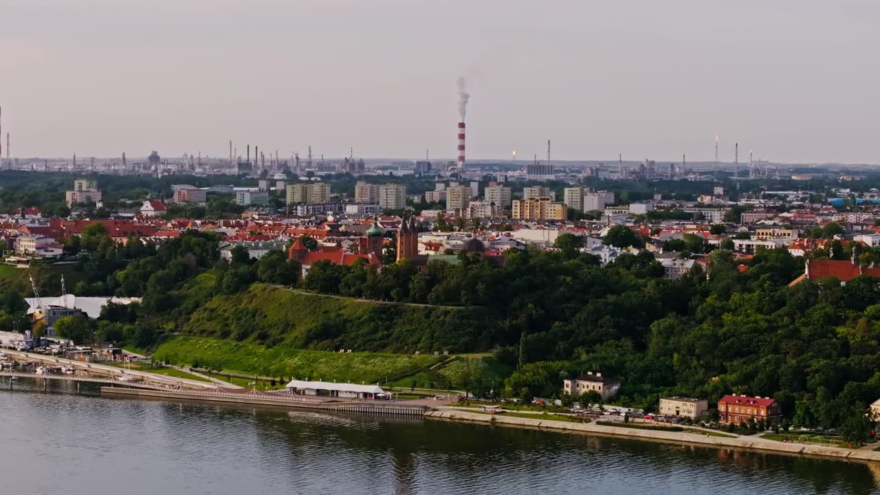 Plock, Poland, oil refinery in background highlights industrial impact on city
