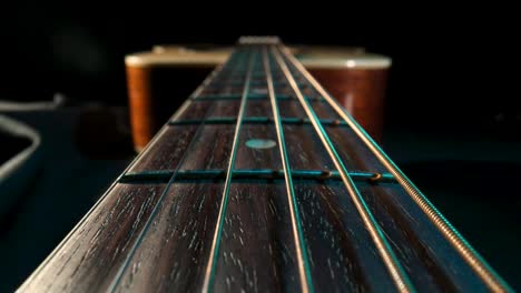 Close-up of an Acoustic Guitar Fretboard