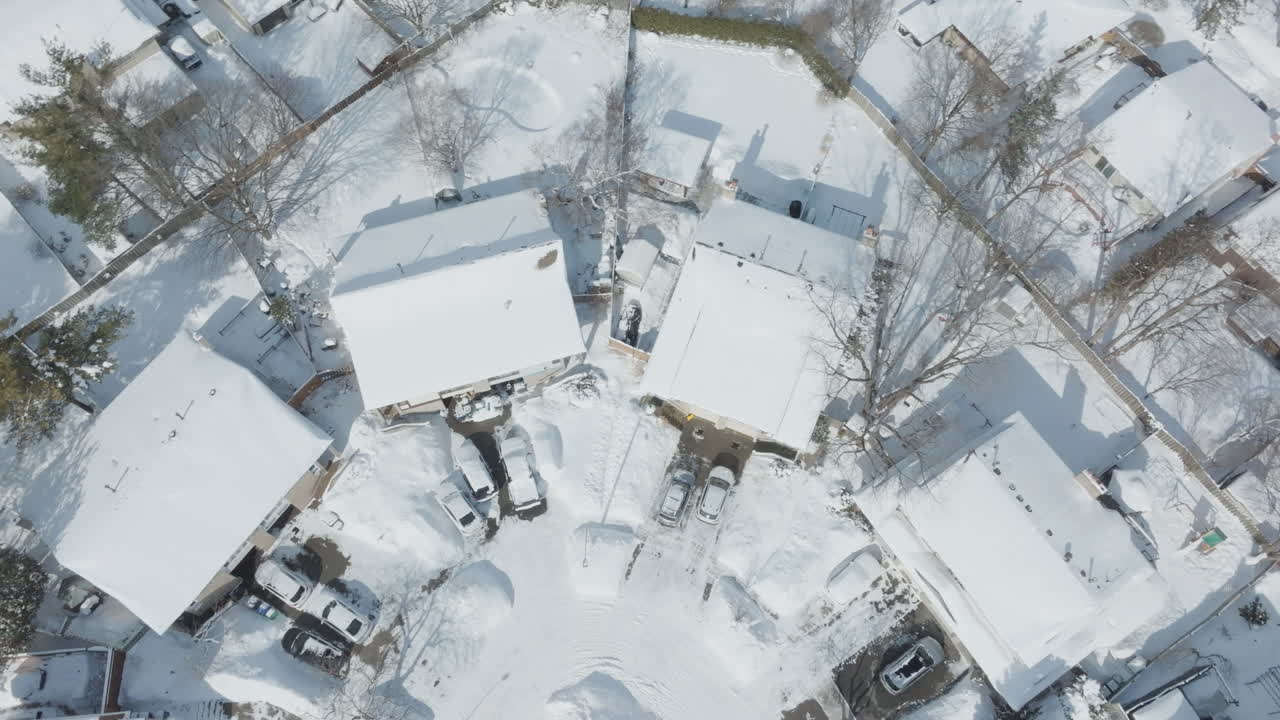 Snow-covered buildings in winter, aerial view, calm and serene mood