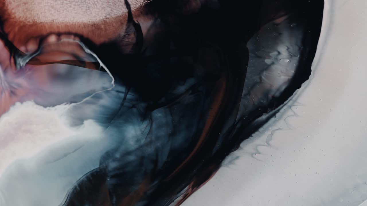 Swirling paint ink with different colors , emerging Beautiful art effect, Close up