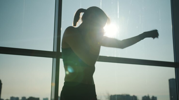 Woman Boxing Workout by a Window