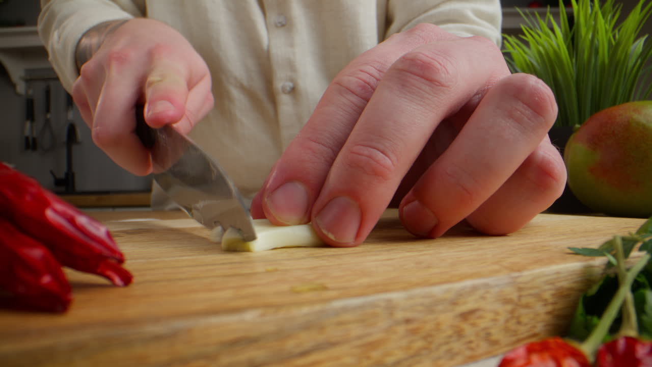 Chef cutting garlic
