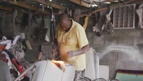 african man burning an object