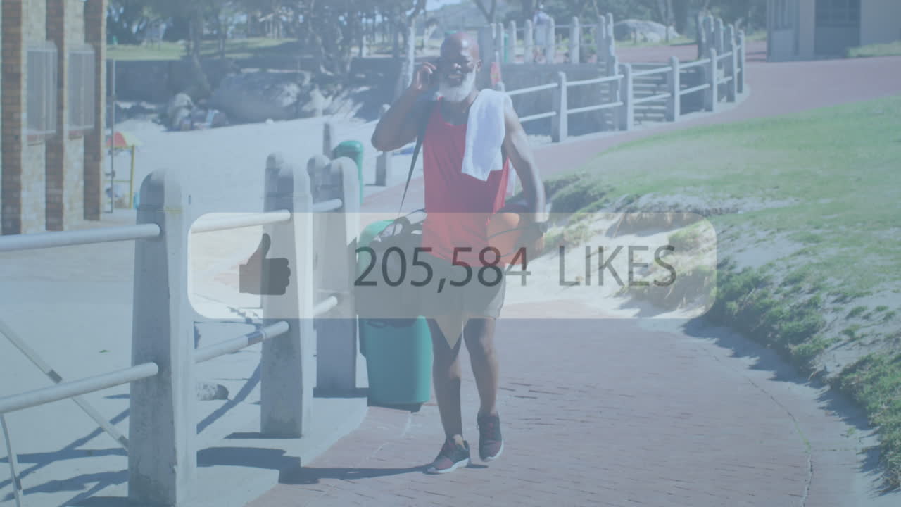 해변에서 스마트폰을 사용하는 노인 아프리카계 미국인 남성의 미디어 아이콘의 애니메이션