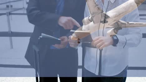 Airplane-flying-against-couple-checking-their-passports-in-the-airport