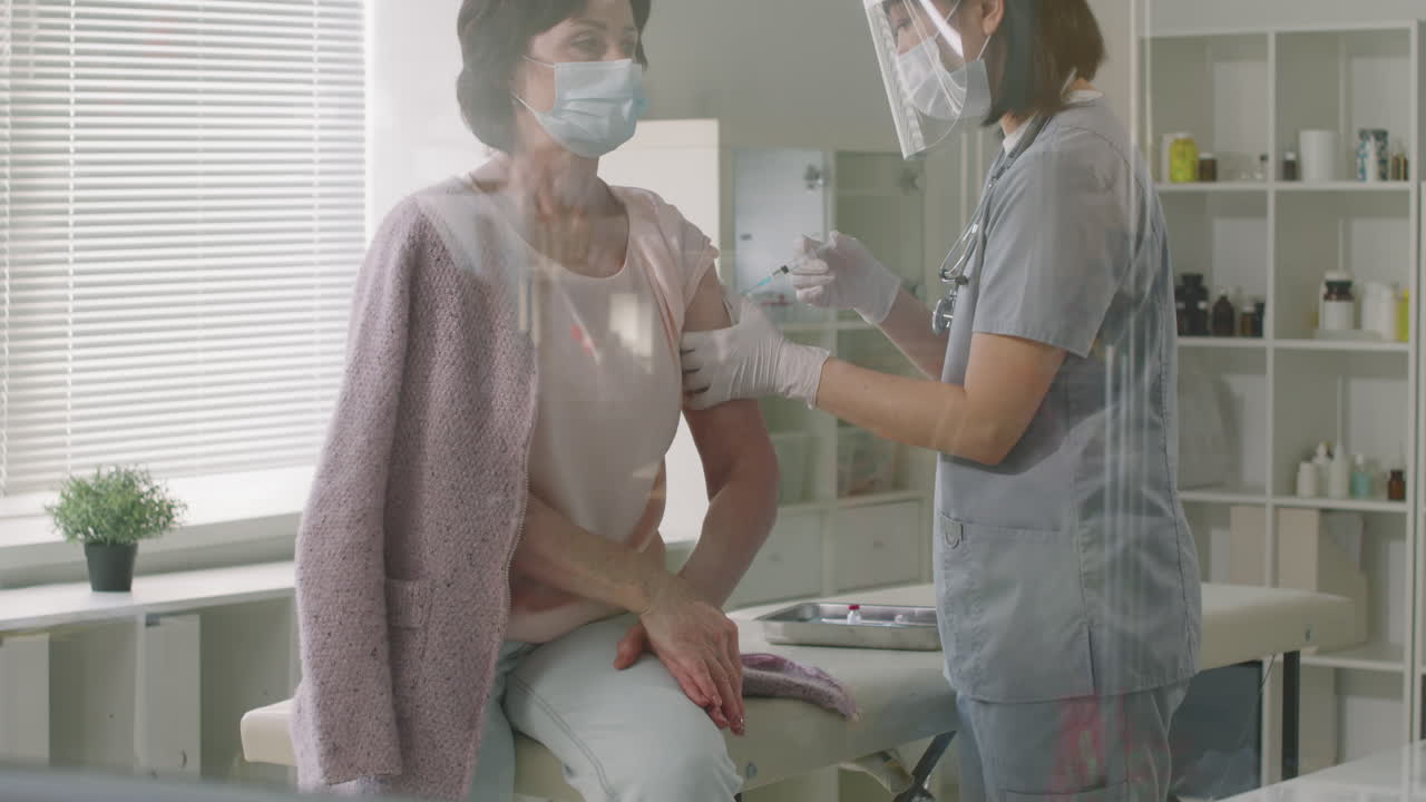 Mature Woman Gets Vaccinated Against Covid-19