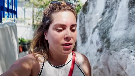 happy woman vlogging on a sunny day in athens