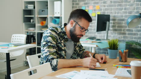 man working on a design project in the office