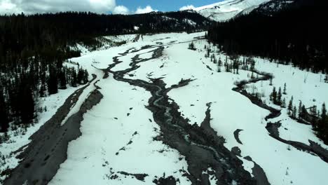 us, oregon, mt hood, white river, 2025-04-22 - drone view of the frozen river that comes down from mt hood. on a beautiful spring day.