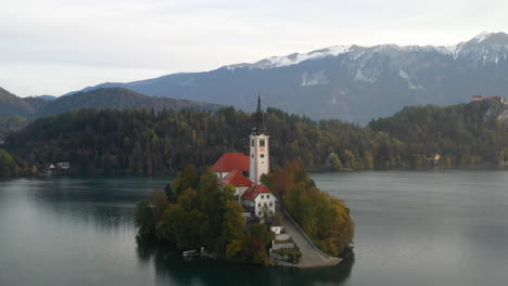 rotating revealing drone shot of the pilgrimage church of the assumption of mary, slovenia