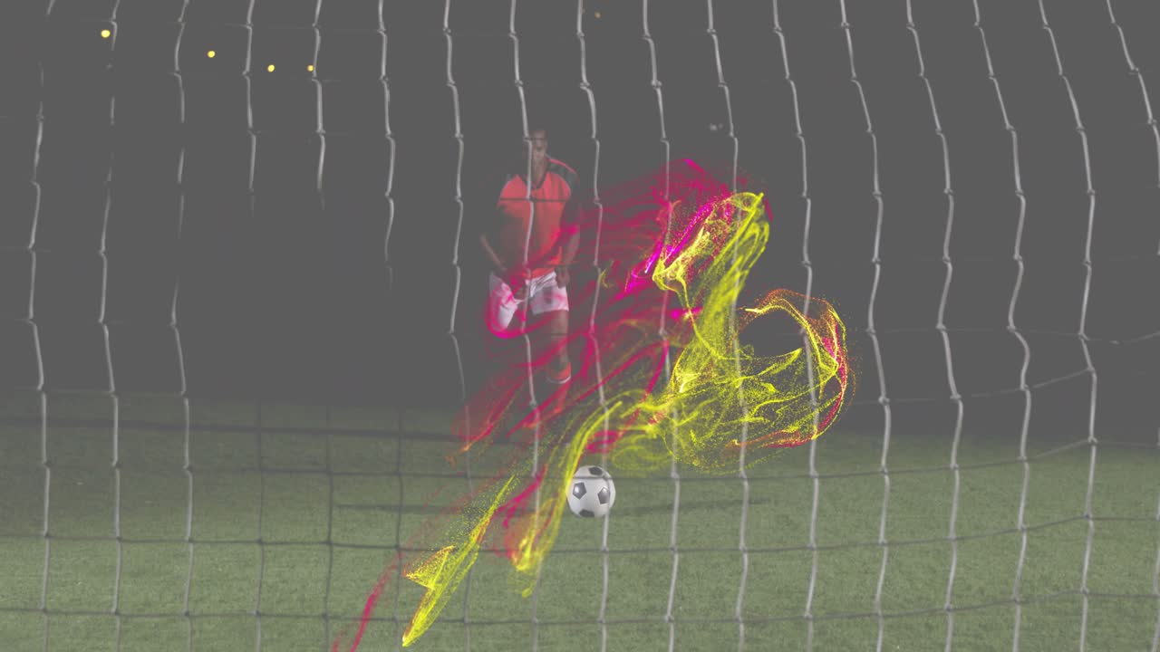 Kaleci, kale ağının yakınında ağırlık değiştiriyor, neon enerji izleri başlatıyor ve futbol teknolojisinde topa yön veriyor