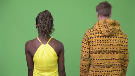 young multi-ethnic couple with arms crossed together