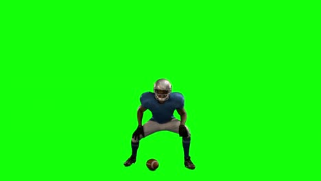 american football player in attack stance