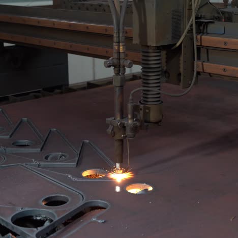 laser cutter in the production. industrial cnc plasma cutting of metal plate. production industry.