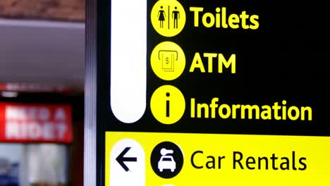 directional signs at airport terminal