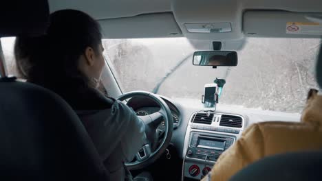 woman driving a car in winter