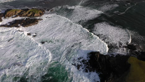 cinematic tilting upward drone shot of the white cliffs of ashleam, ireland on the wild atlantic way