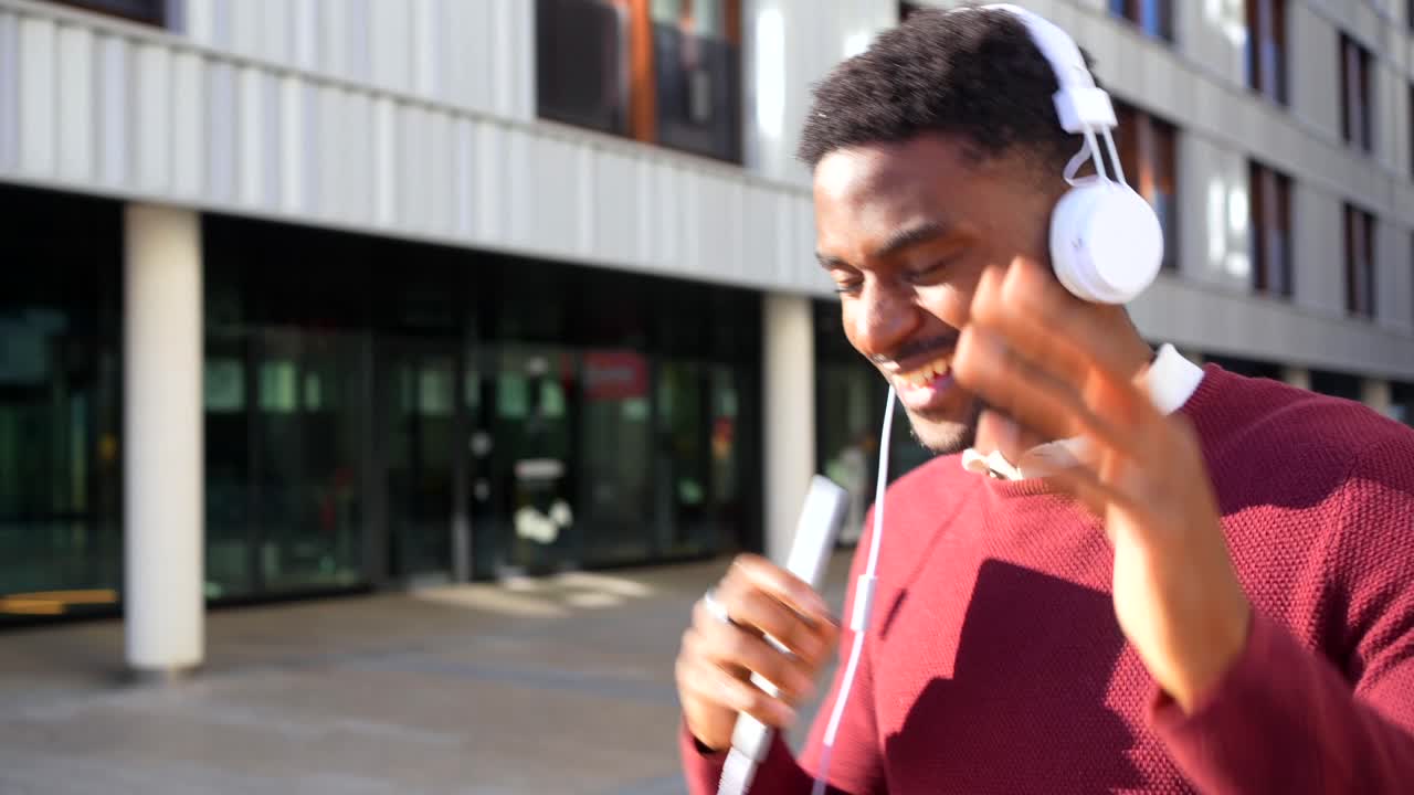 Man listening to music with headphones outdoors