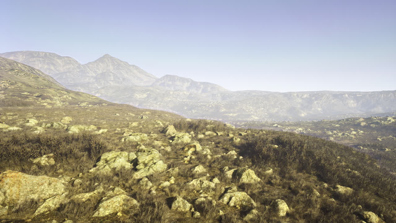 Stony landscape with mountains under clear blue sky on sunny day