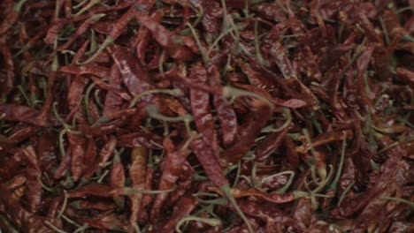 red hot chili peppers in a jute bag on the market in india