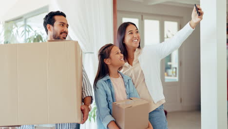 Parents,-child-and-video-call-at-new-home